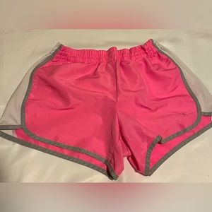 The brand is Danskin now. The shorts are a pink, white, and grey color.